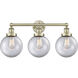 Beacon 3 Light 24.5 inch Antique Brass Bath Vanity Light Wall Light in Clear